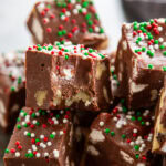 stack of rocky road fudge with one piece with a bite out of it