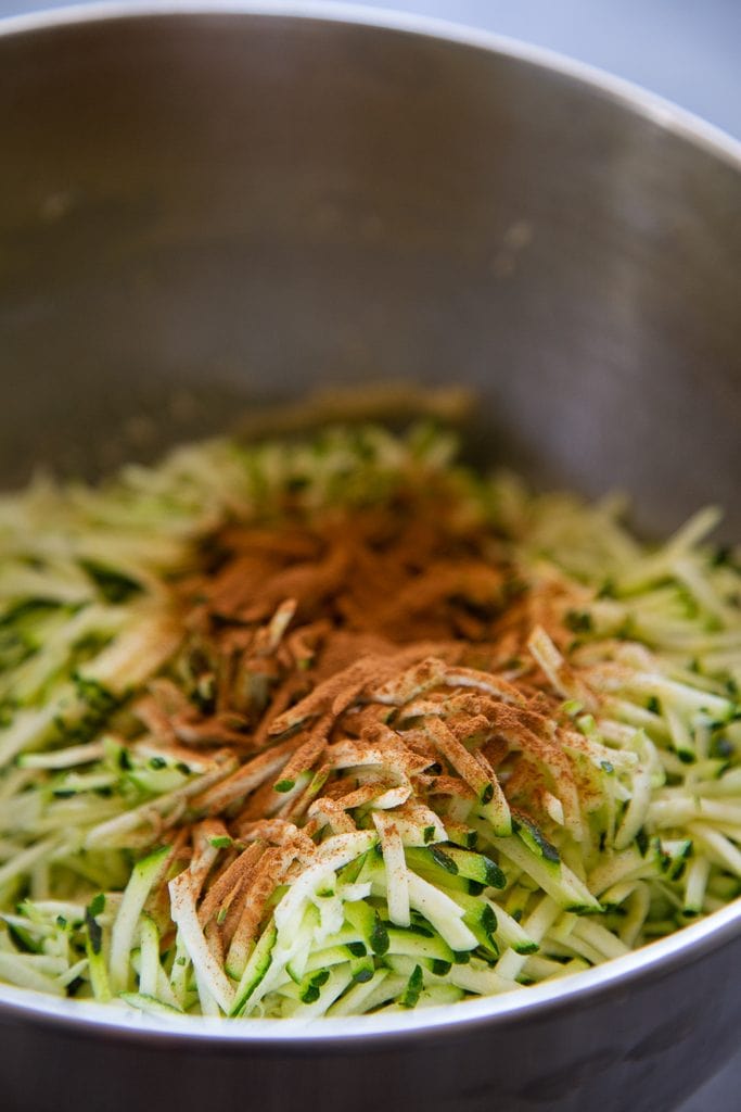 shredded zucchini in mixing bowl