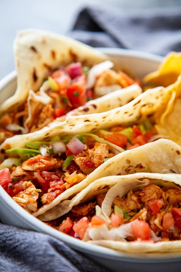 close up shot soft chicken tacos