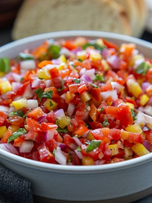 close up shot of tomato pepper bruschetta in bowl