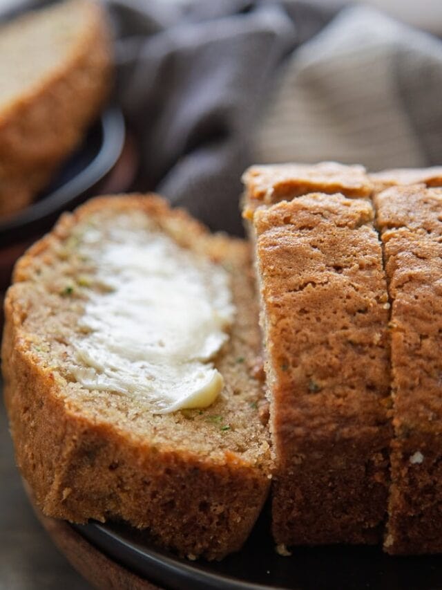 slices of zucchini bread and one with butter