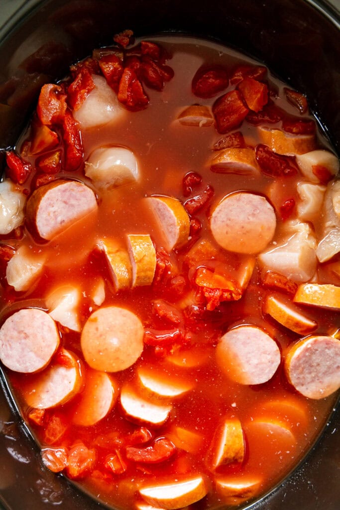 overhead shot crock pot with gumbo ingredients