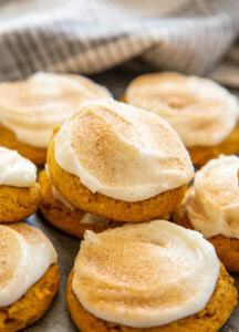 bunch of frosted pumpkin cookies